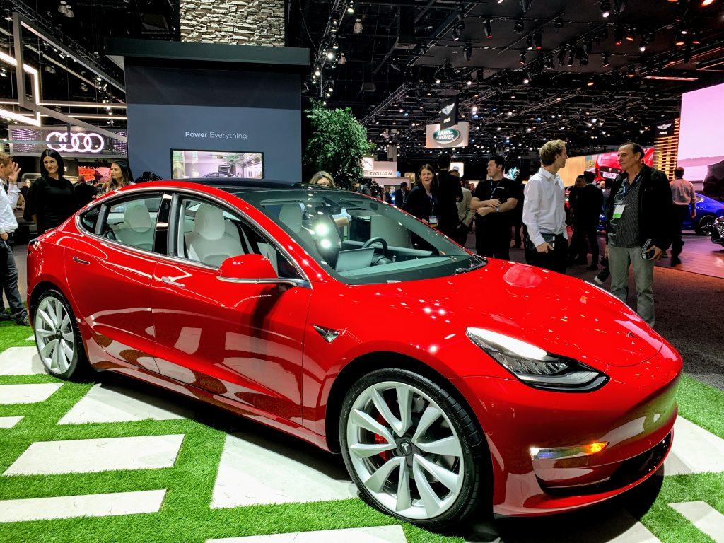 Red Tesla Model 3 at the 2019 LA auto show