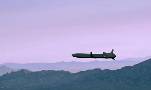 A Long Range Standoff weapon (LRSO) flies over a mountain range