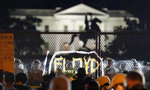 Protesters at night outside the White House in Lafayette Square