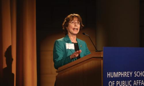 Kathy Rest speaking at an event