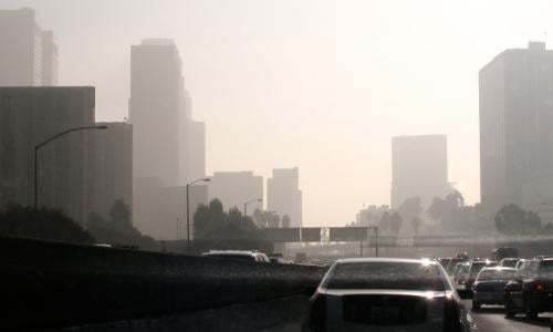 Cars in traffic producing air pollution on LA's Pasadena highway.